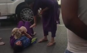 Woman requests Delhi police for hotel accommodation while lying on road, video goes viral